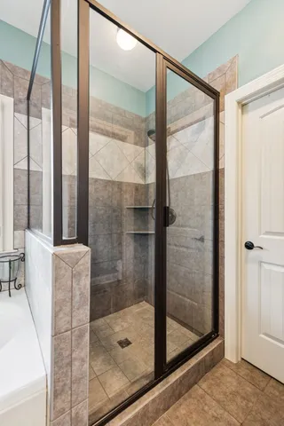 a bathroom with a tub sink and a window