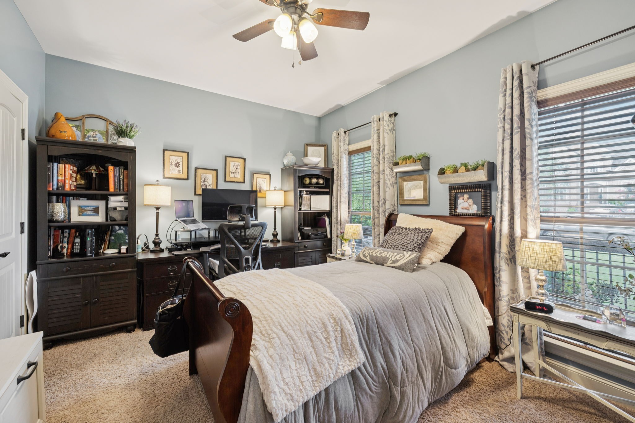 4003 Campania Strada Spring Hill, TN 37174 - Photo 32 of 50 a bedroom with a bed a dresser and a chandelier