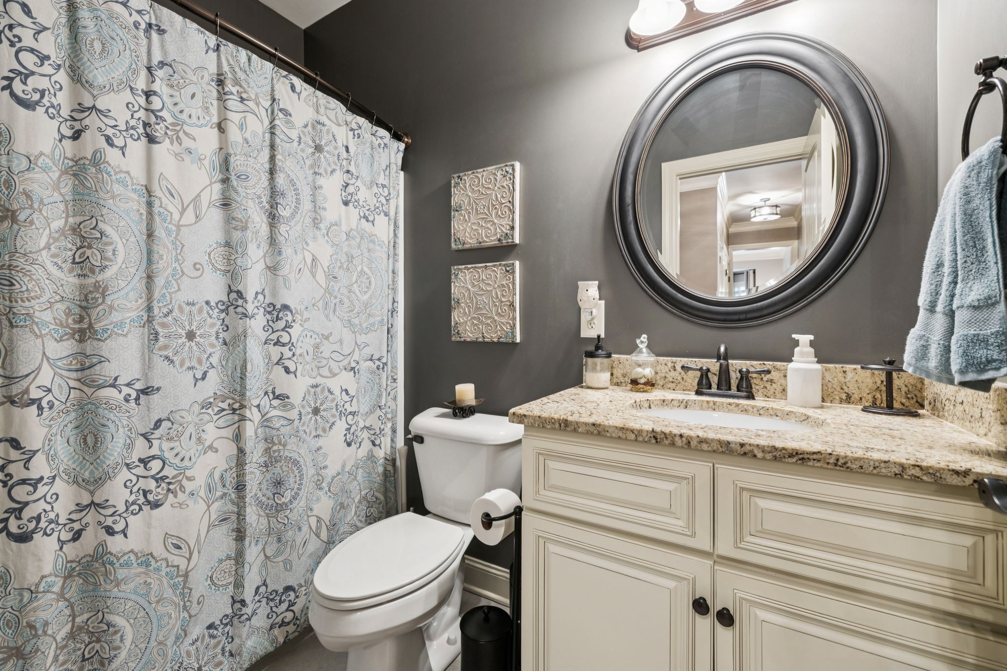 4003 Campania Strada Spring Hill, TN 37174 - Photo 34 of 50 a bathroom with a granite countertop toilet a sink and a mirror