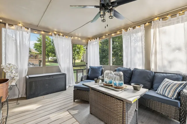 a living room with furniture and a window