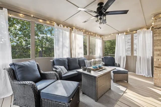 a view of a house with a big yard and sitting area