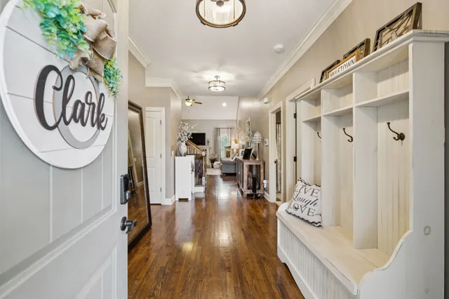 a very nice looking room with a dining table a chandelier