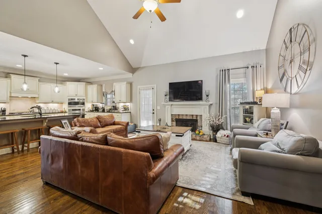 a living room with furniture fireplace and a flat screen tv