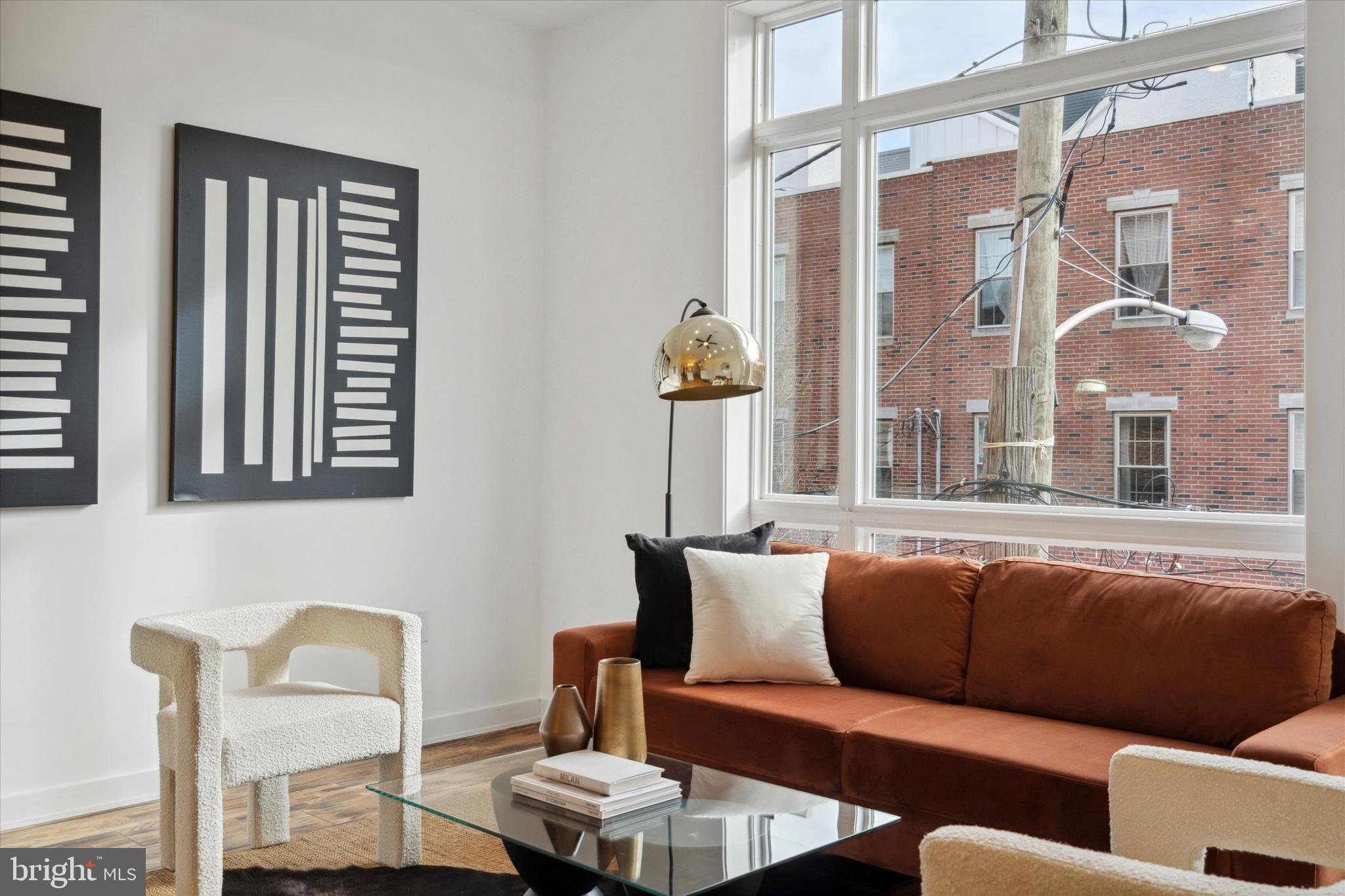 1825 Ginnodo Street, Unit R2 Philadelphia, PA 19130 - Photo 13 of 38 a living room with furniture and a window