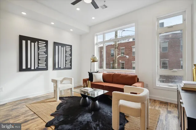 a view of living room with furniture and a mirror