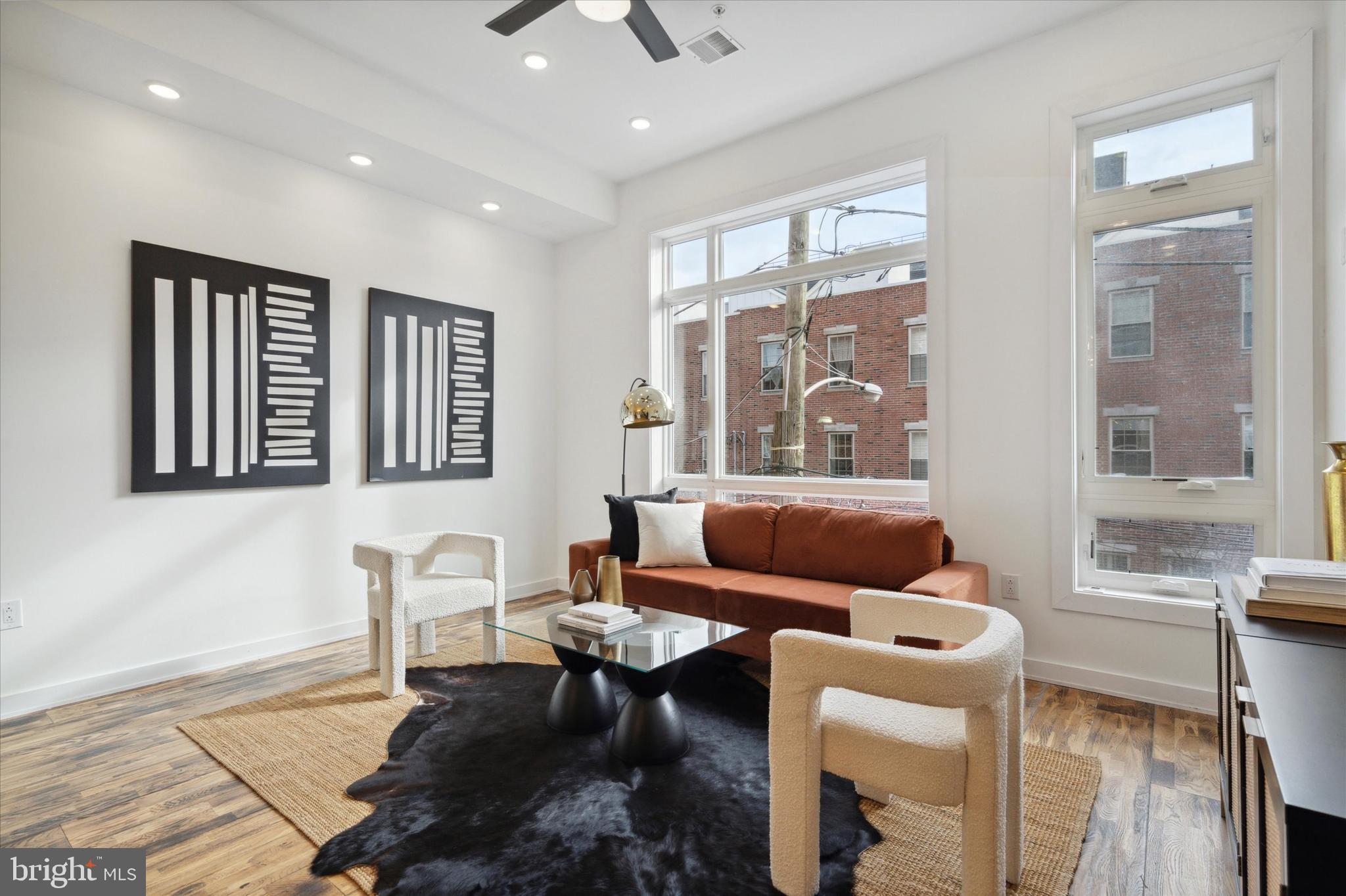 1825 Ginnodo Street, Unit R2 Philadelphia, PA 19130 - Photo 15 of 38 a living room with furniture and a window