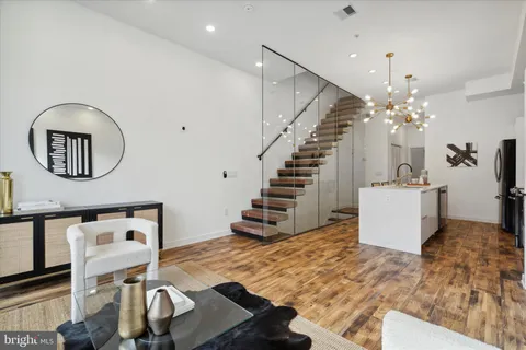 a view of entryway with wooden floor