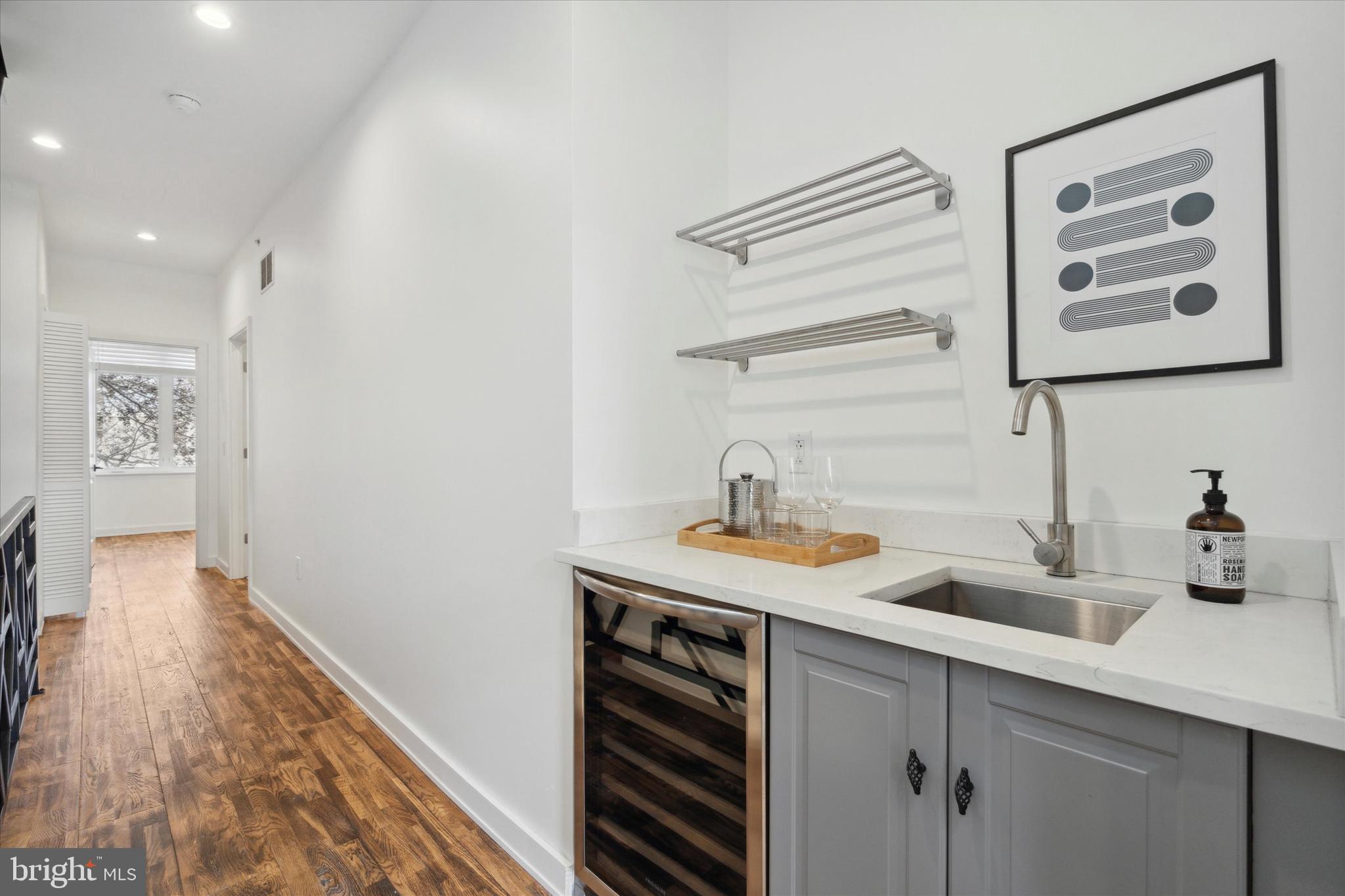 1825 Ginnodo Street, Unit R2 Philadelphia, PA 19130 - Photo 21 of 38 a bathroom with a sink and a mirror