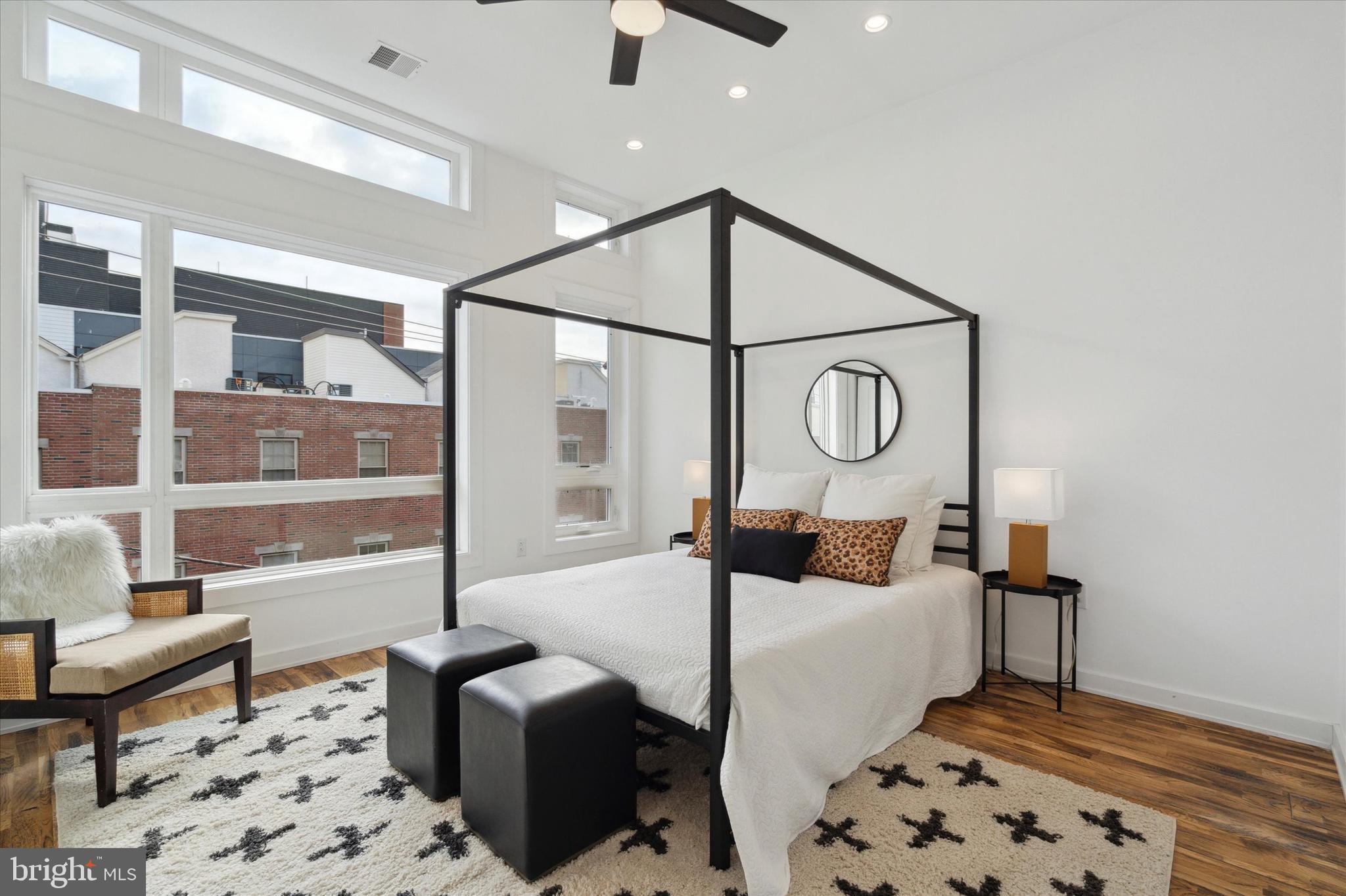 1825 Ginnodo Street, Unit R2 Philadelphia, PA 19130 - Photo 22 of 38 a bedroom with furniture and wooden floor