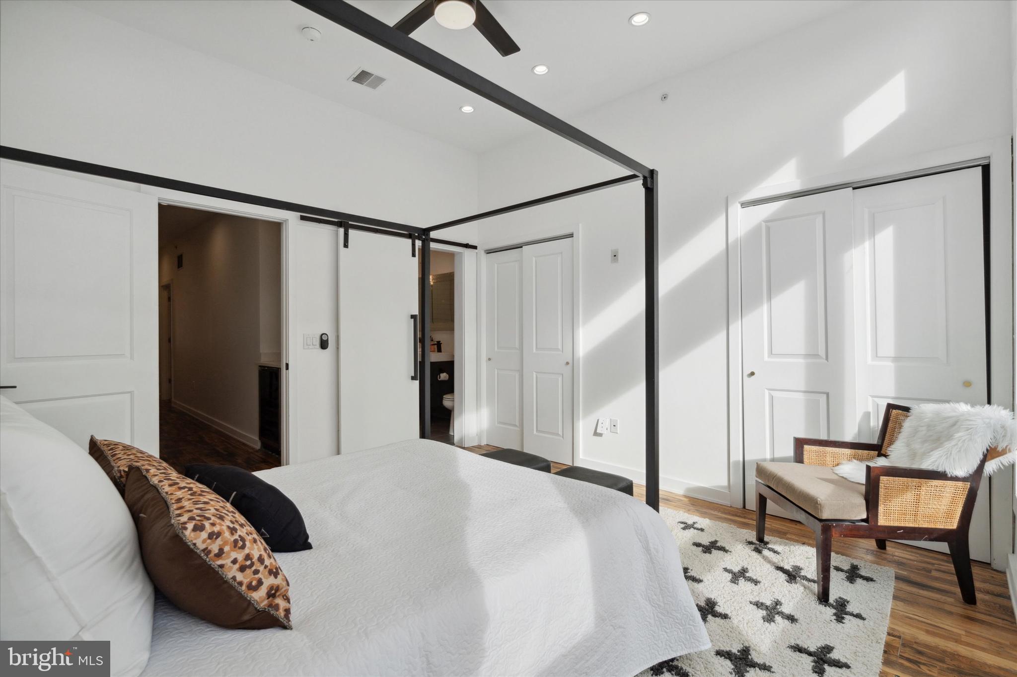 1825 Ginnodo Street, Unit R2 Philadelphia, PA 19130 - Photo 23 of 38 a bedroom with a bed and a chair in it