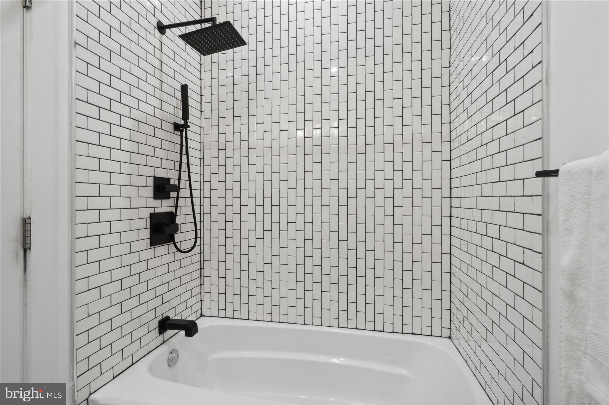1825 Ginnodo Street, Unit R2 Philadelphia, PA 19130 - Photo 26 of 38 a bathroom with a bathtub and a shower