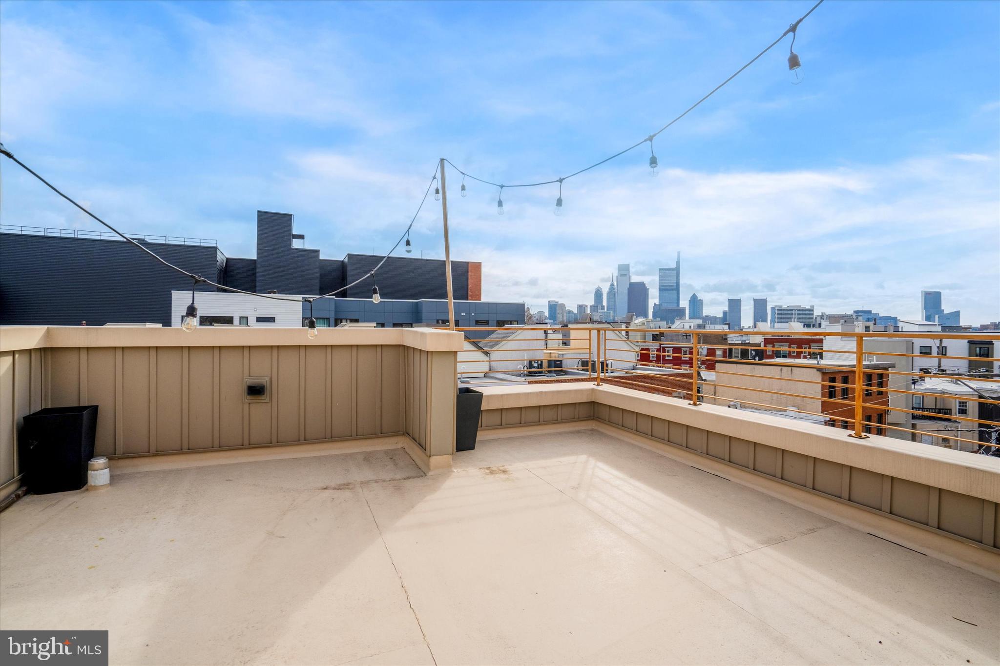 1825 Ginnodo Street, Unit R2 Philadelphia, PA 19130 - Photo 32 of 38 a living room with stainless steel appliances kitchen island granite countertop a sink and cabinets