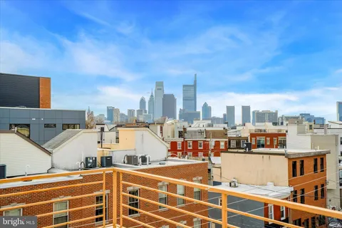 a black and white photo of a bedroom