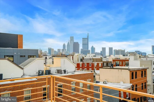 a black and white photo of a bedroom