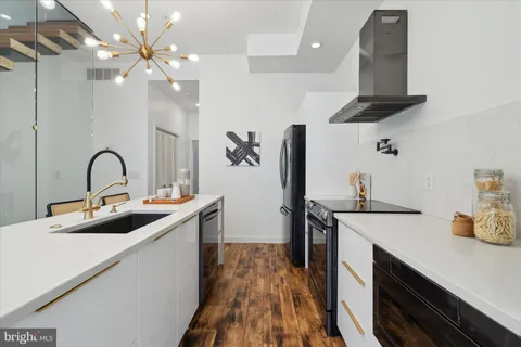 a kitchen with stainless steel appliances kitchen island a island in the center