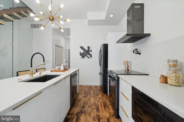 a kitchen with stainless steel appliances kitchen island a island in the center
