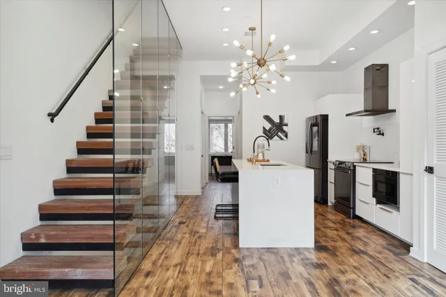 a living room with furniture a rug and a window