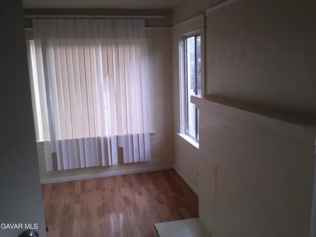 a view of an entryway with wooden floor