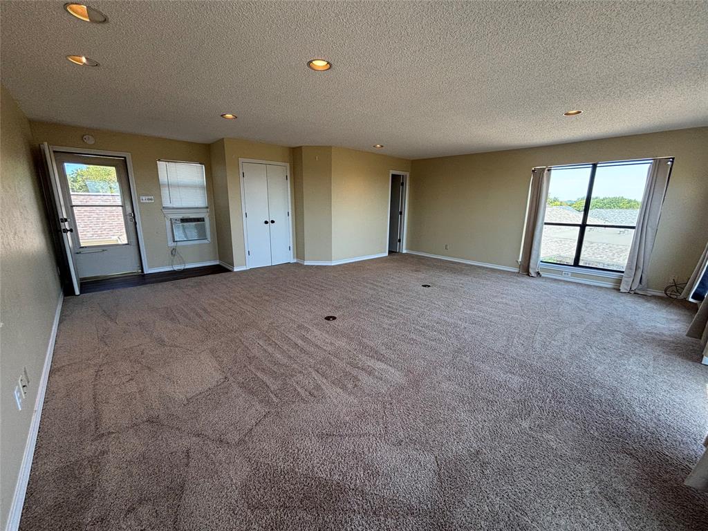 4702 Ranch View Road Fort Worth, TX 76109 - Photo 39 of 40 Expansive room with carpet flooring, recessed lighting, double-door closet, and large window