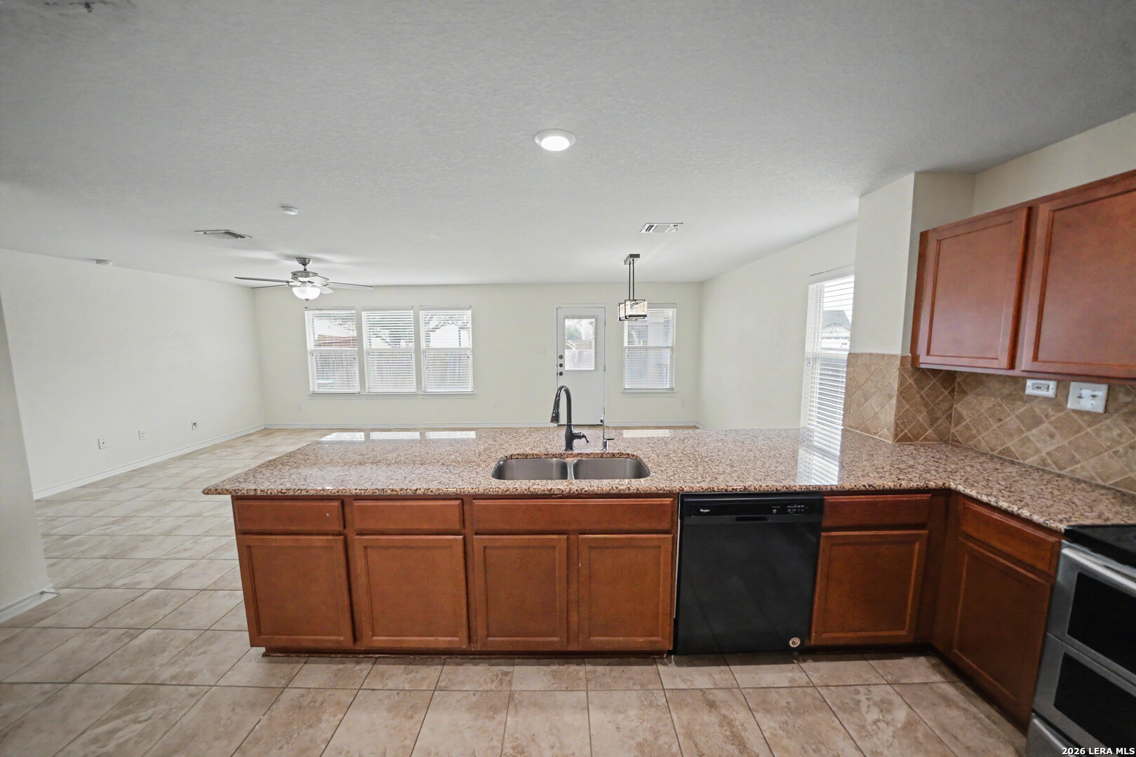 7506 Copper Cove Converse, TX 78109 - Photo 19 of 45 a kitchen with a sink and cabinets