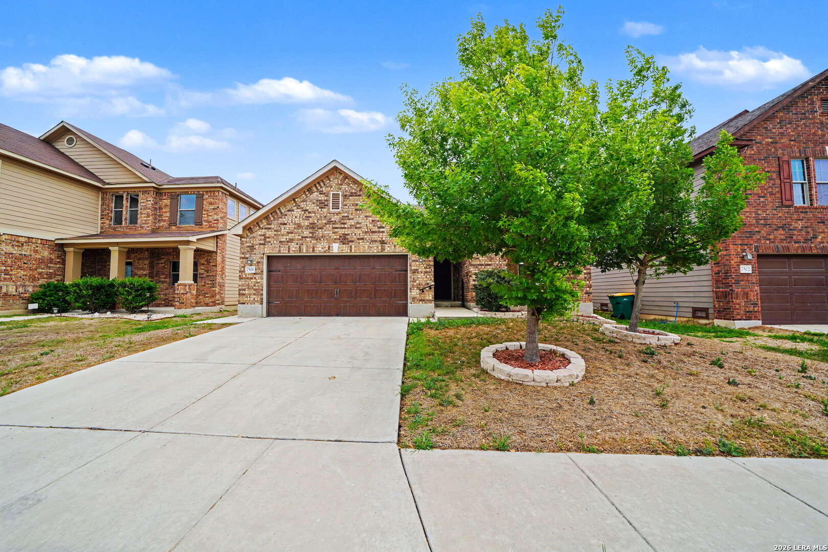 7506 Copper Cove Converse, TX 78109 - Photo 2 of 45 a front view of a house with a garden