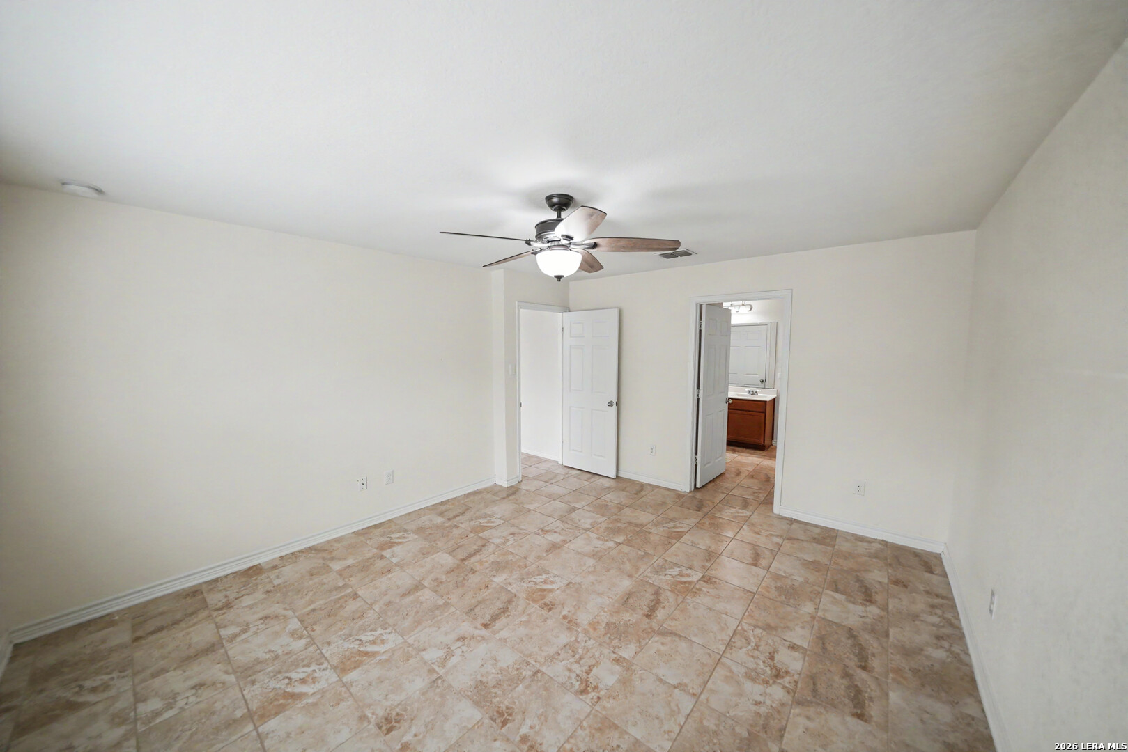 7506 Copper Cove Converse, TX 78109 - Photo 22 of 45 a view of a room with a chandelier fan and windows