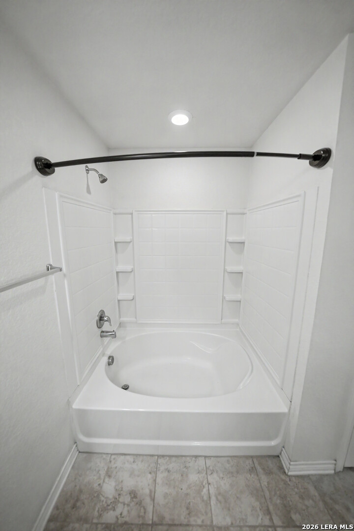 7506 Copper Cove Converse, TX 78109 - Photo 25 of 45 a white bath tub sitting next to a white sink and vanity