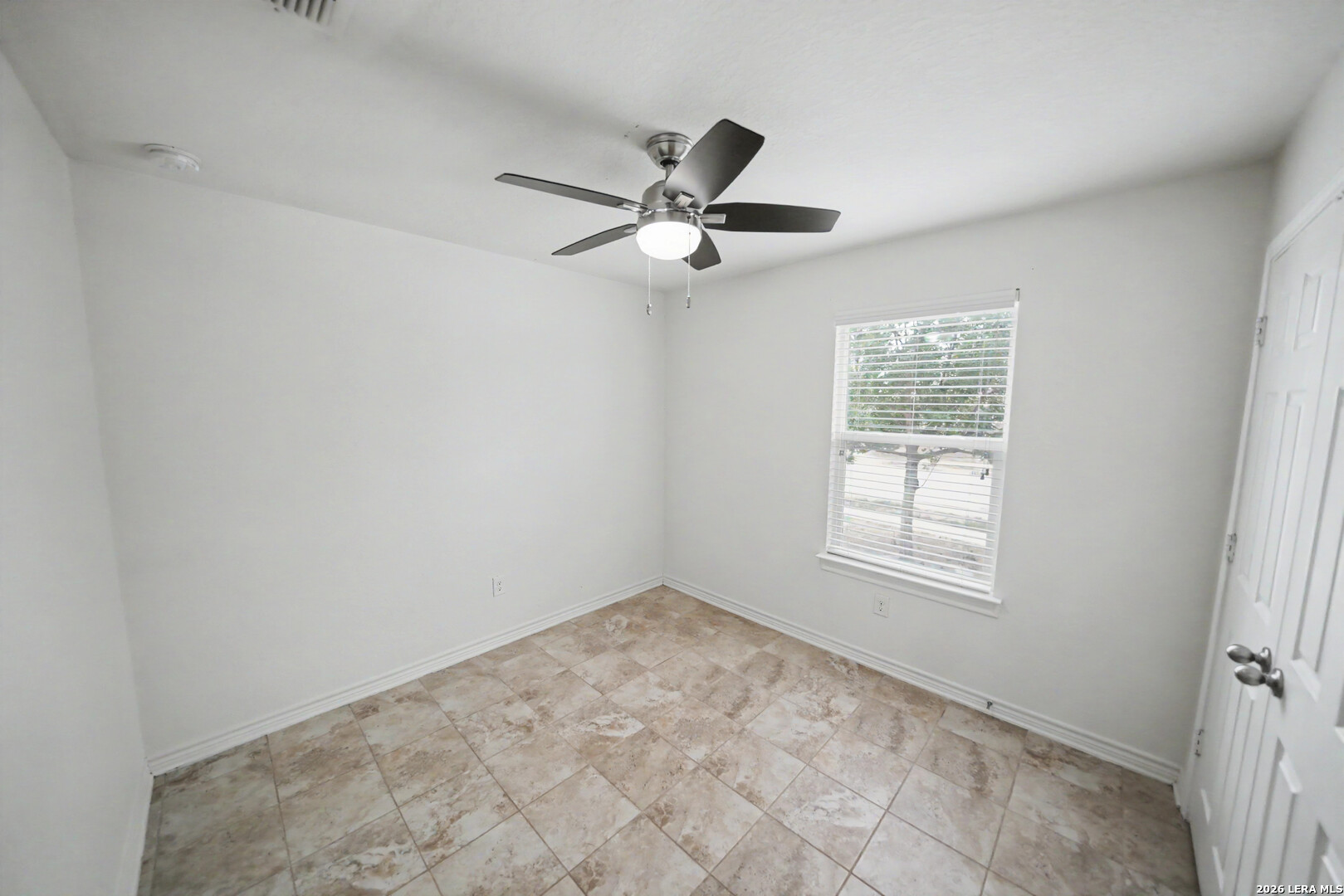 7506 Copper Cove Converse, TX 78109 - Photo 27 of 45 an empty room with windows and fan
