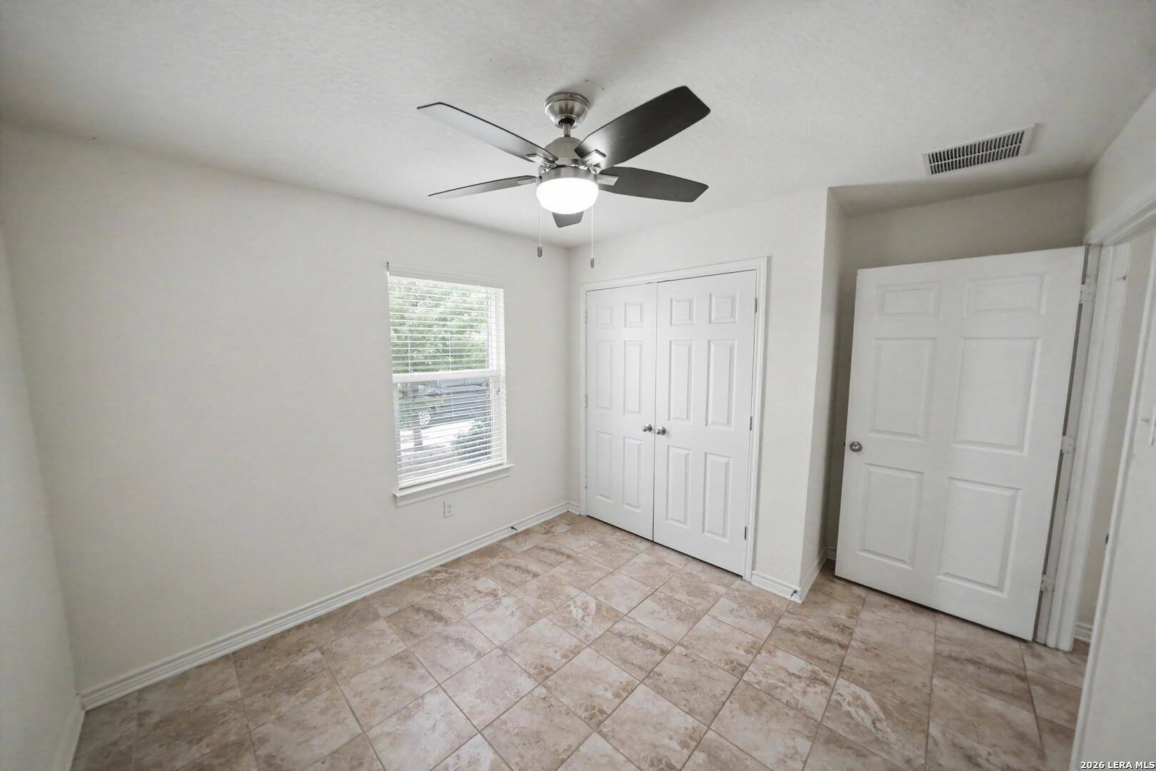 7506 Copper Cove Converse, TX 78109 - Photo 28 of 45 a view of an empty room with a window