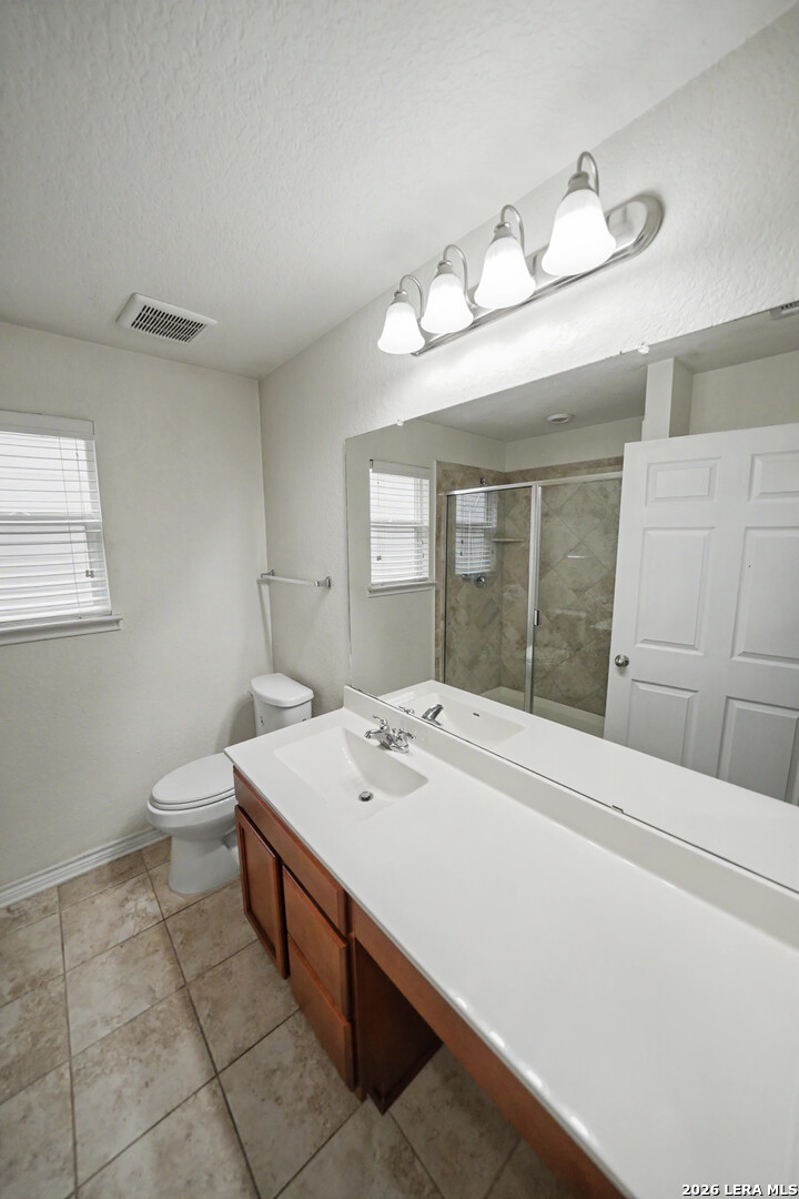 7506 Copper Cove Converse, TX 78109 - Photo 29 of 45 a bathroom with a sink and a mirror