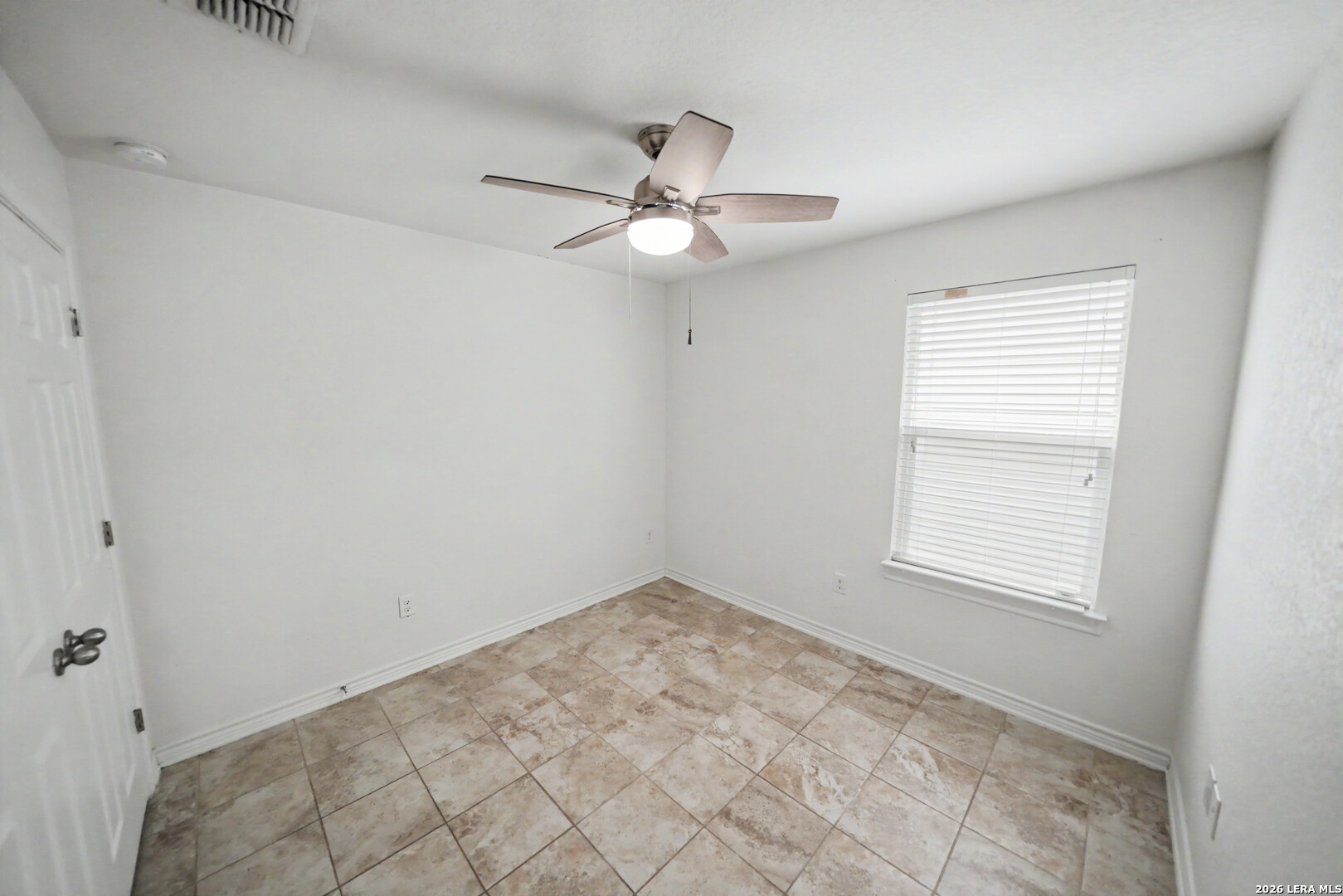 7506 Copper Cove Converse, TX 78109 - Photo 31 of 45 an empty room with fan and windows
