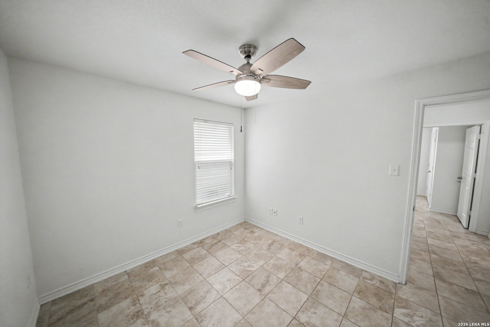 7506 Copper Cove Converse, TX 78109 - Photo 32 of 45 an empty room with fan and window