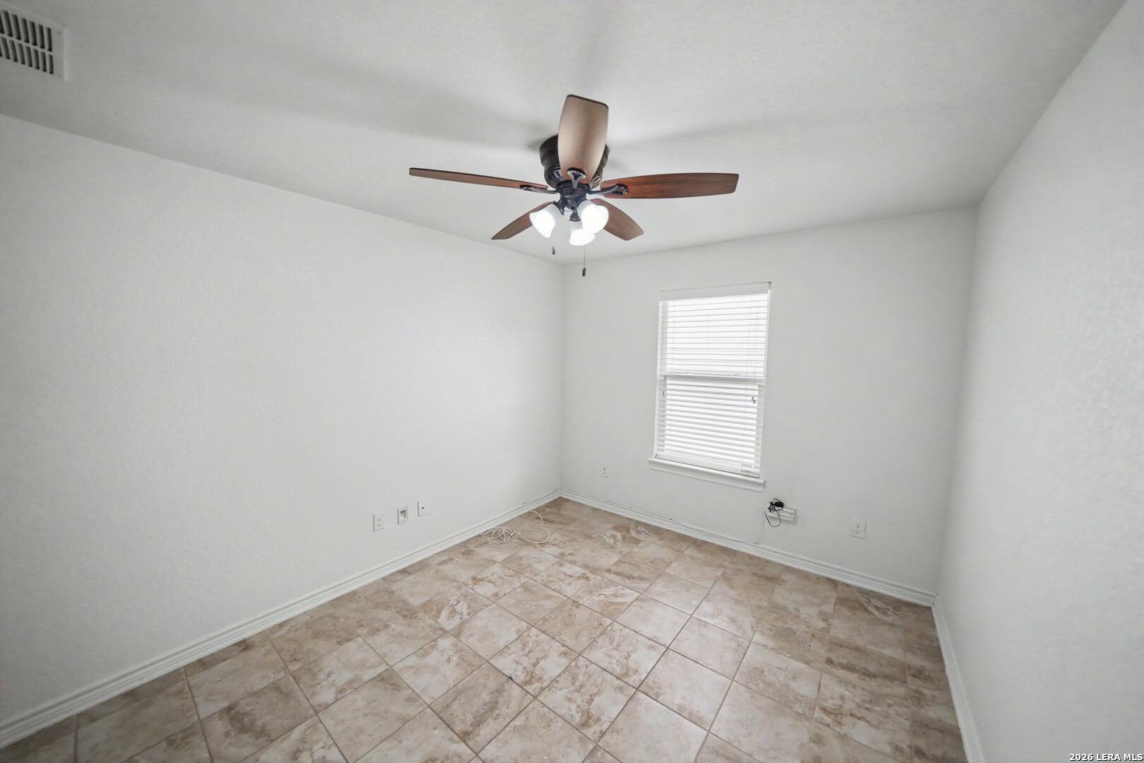 7506 Copper Cove Converse, TX 78109 - Photo 36 of 45 a view of a room with a window and a fan