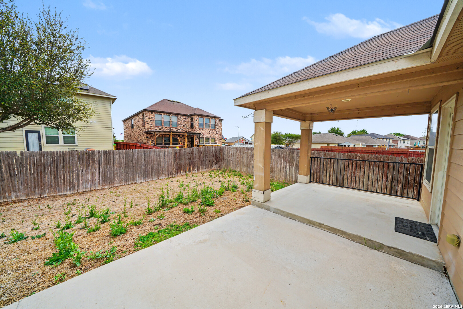 7506 Copper Cove Converse, TX 78109 - Photo 39 of 45 a front view of a house with a wooden fence