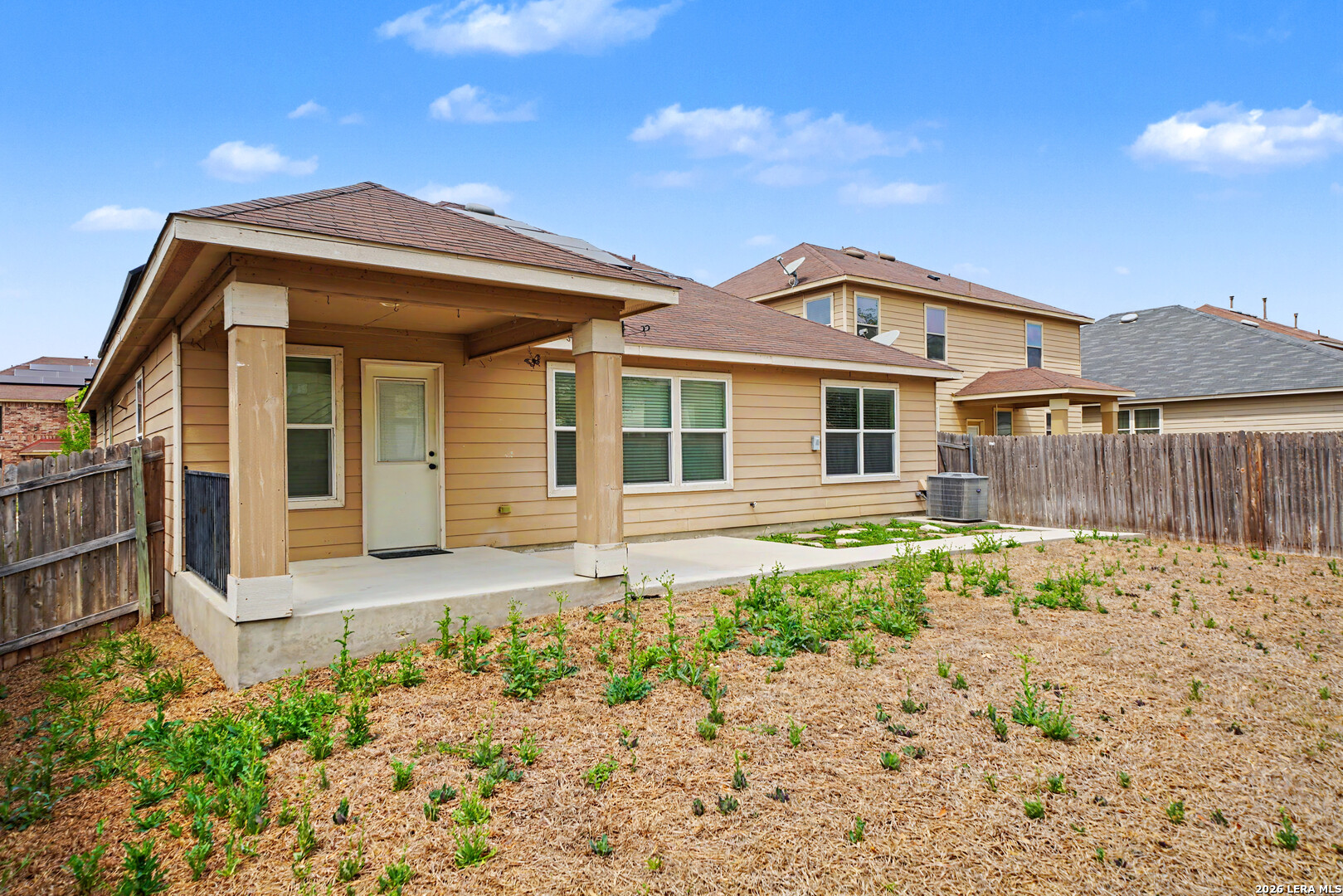 7506 Copper Cove Converse, TX 78109 - Photo 42 of 45 a front view of a house with a garden
