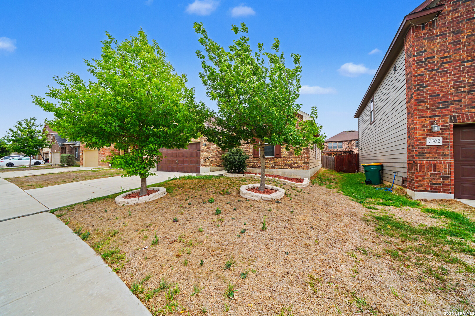 7506 Copper Cove Converse, TX 78109 - Photo 6 of 45 a view of a backyard with a tree