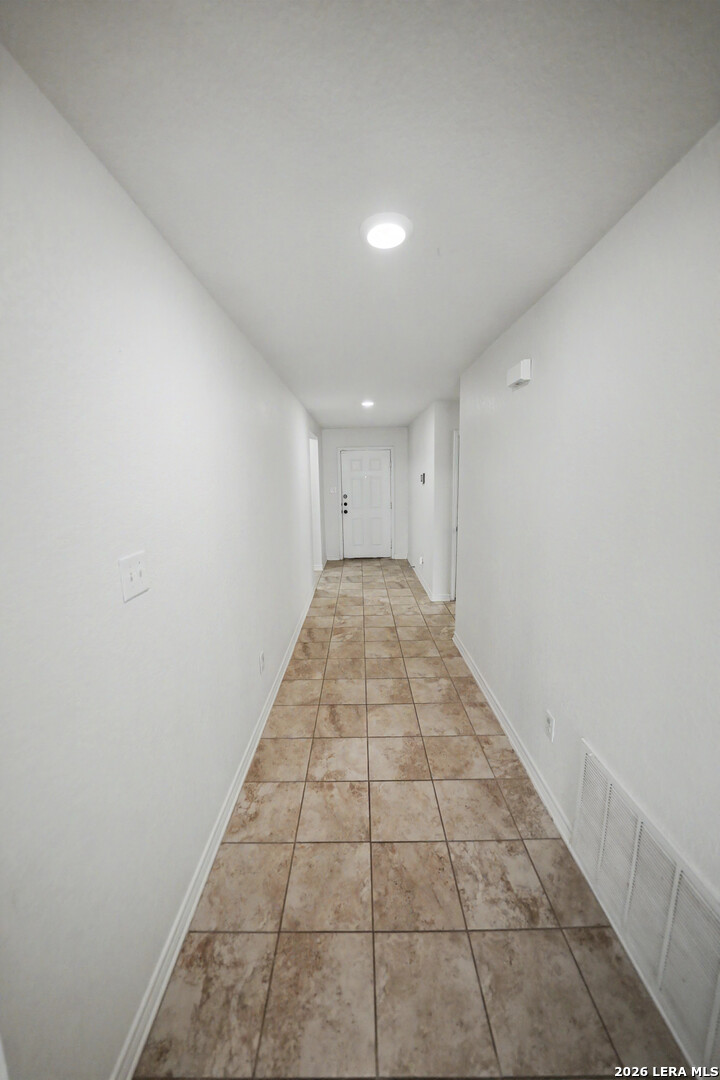 7506 Copper Cove Converse, TX 78109 - Photo 8 of 45 en empty room with white walls