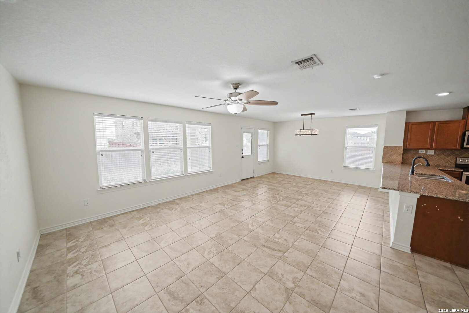 7506 Copper Cove Converse, TX 78109 - Photo 9 of 45 a view of an empty room with a window