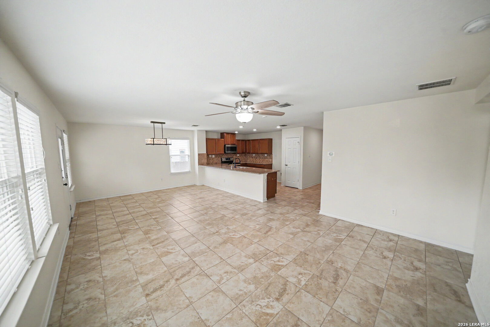 7506 Copper Cove Converse, TX 78109 - Photo 10 of 45 a view of a kitchen with a sink and a refrigerator