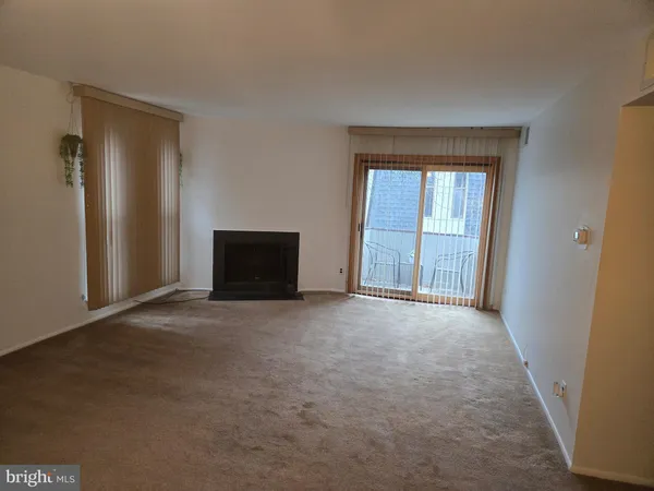 a view of an empty room and window