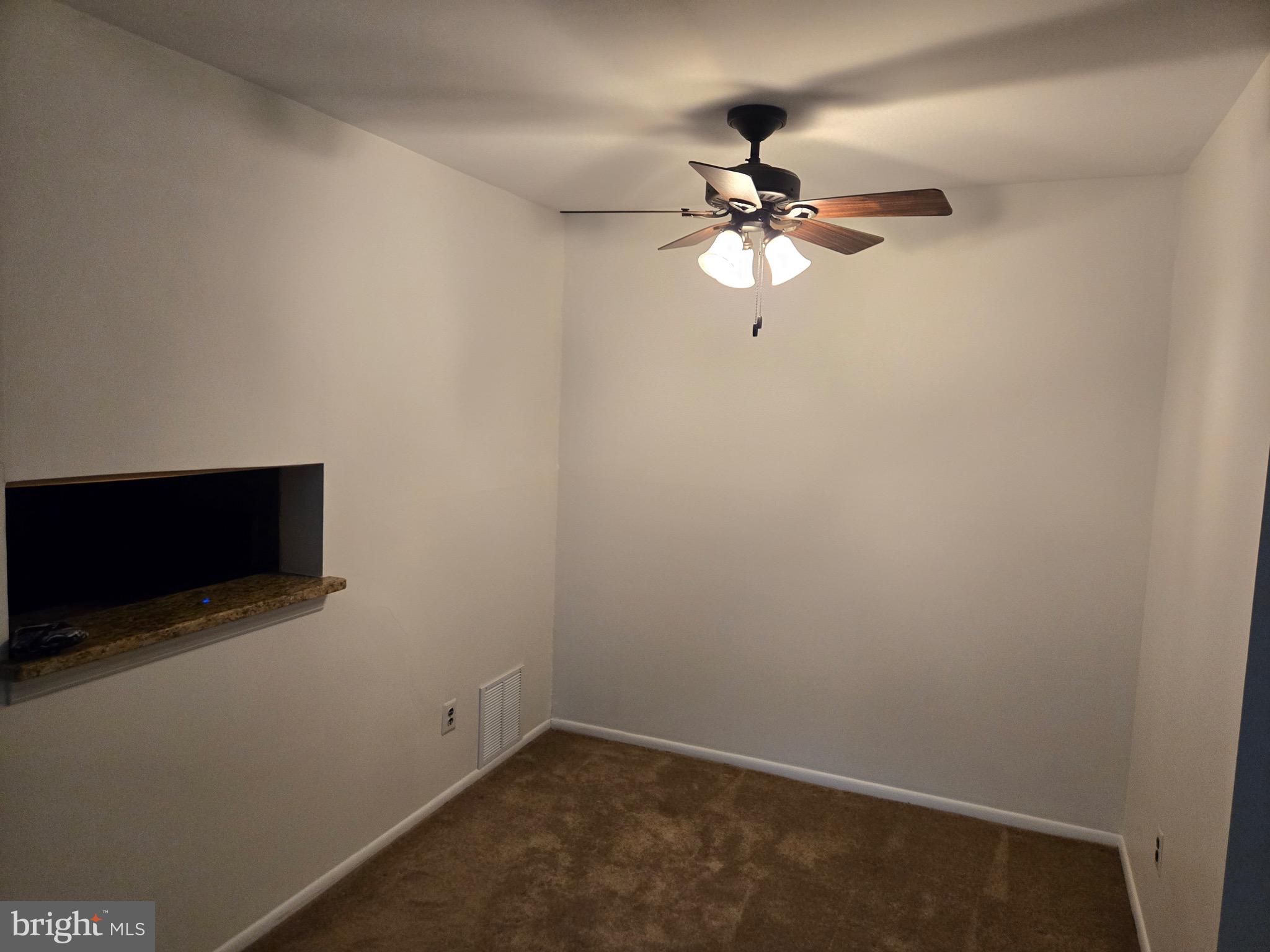 25 South Church Road, Unit 36 Maple Shade, NJ 08052 - Photo 5 of 8 an empty room with a fan and a fan