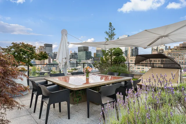 a living room with furniture and large windows