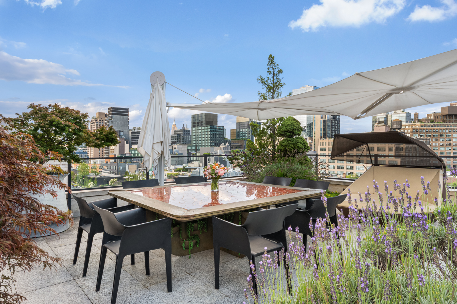 70 Vestry Street, Unit PHS Manhattan, NY 10013 - Photo 10 of 34 a view of a dining table and chairs in patio