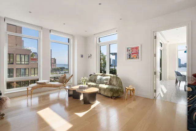 a dining room with furniture and a floor to ceiling window