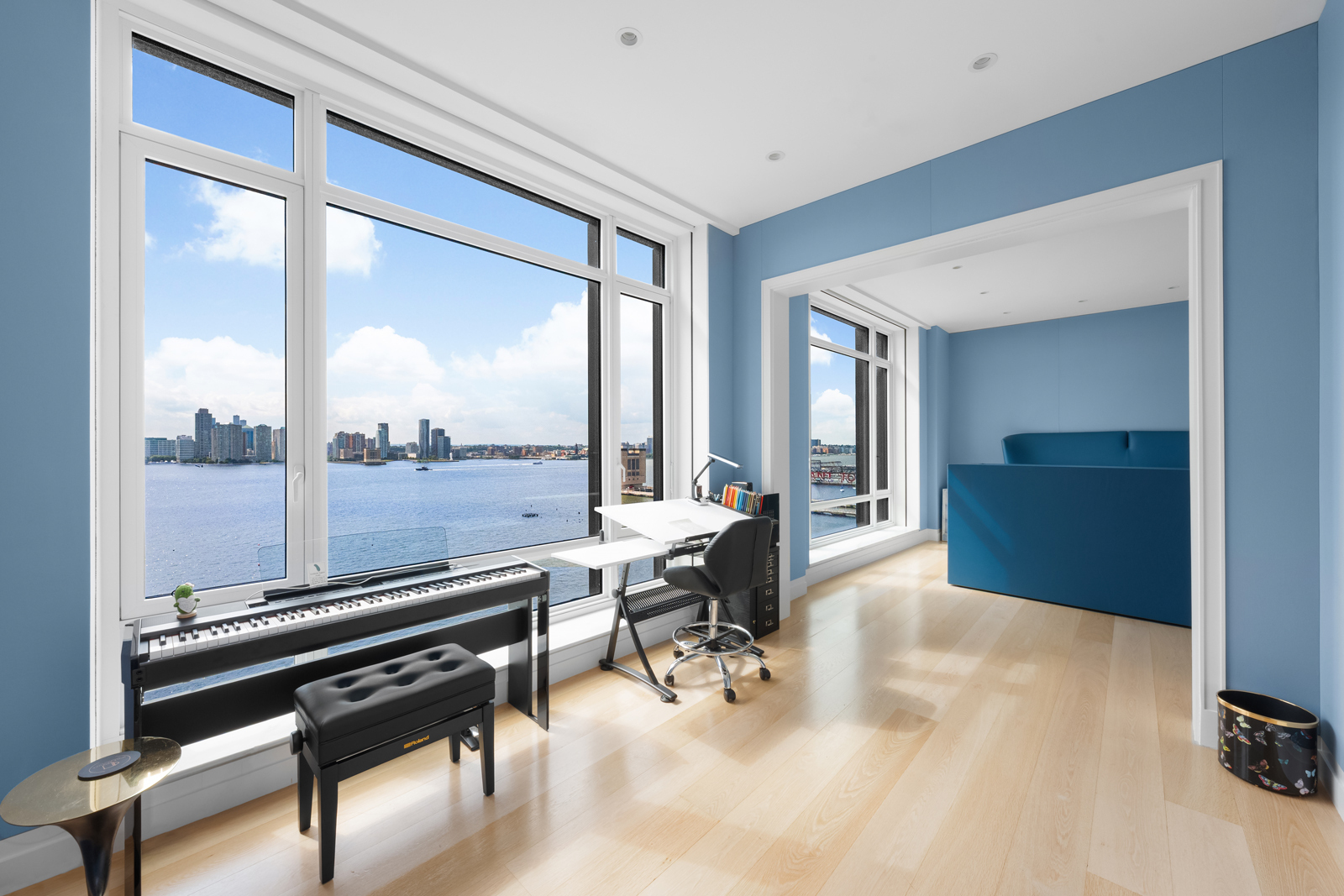 70 Vestry Street, Unit PHS Manhattan, NY 10013 - Photo 16 of 34 a living room with furniture water view and large windows