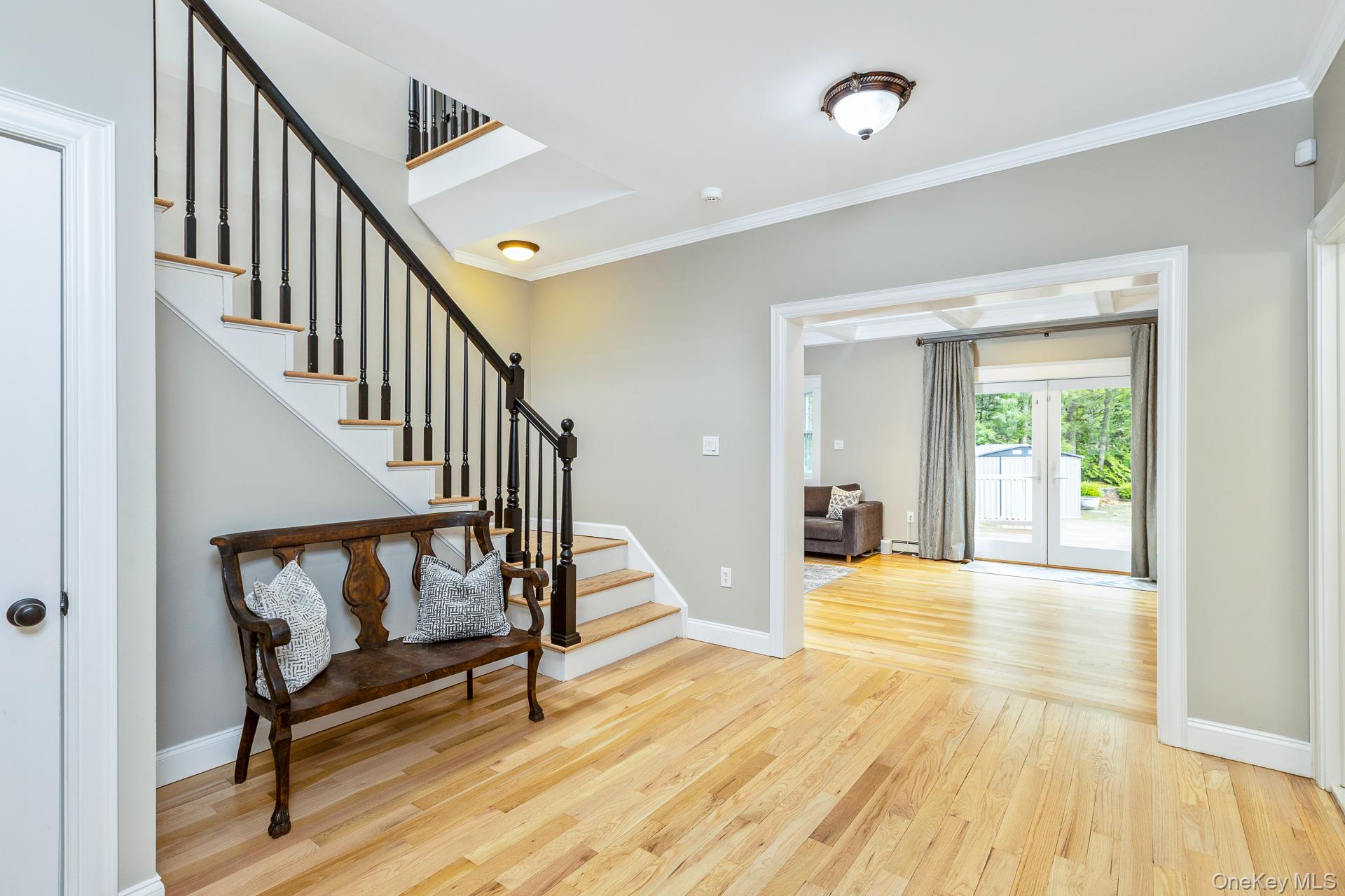 26 Box Tree Road East Quogue, NY 11942 - Photo 11 of 49 a view of an entryway with wooden floor