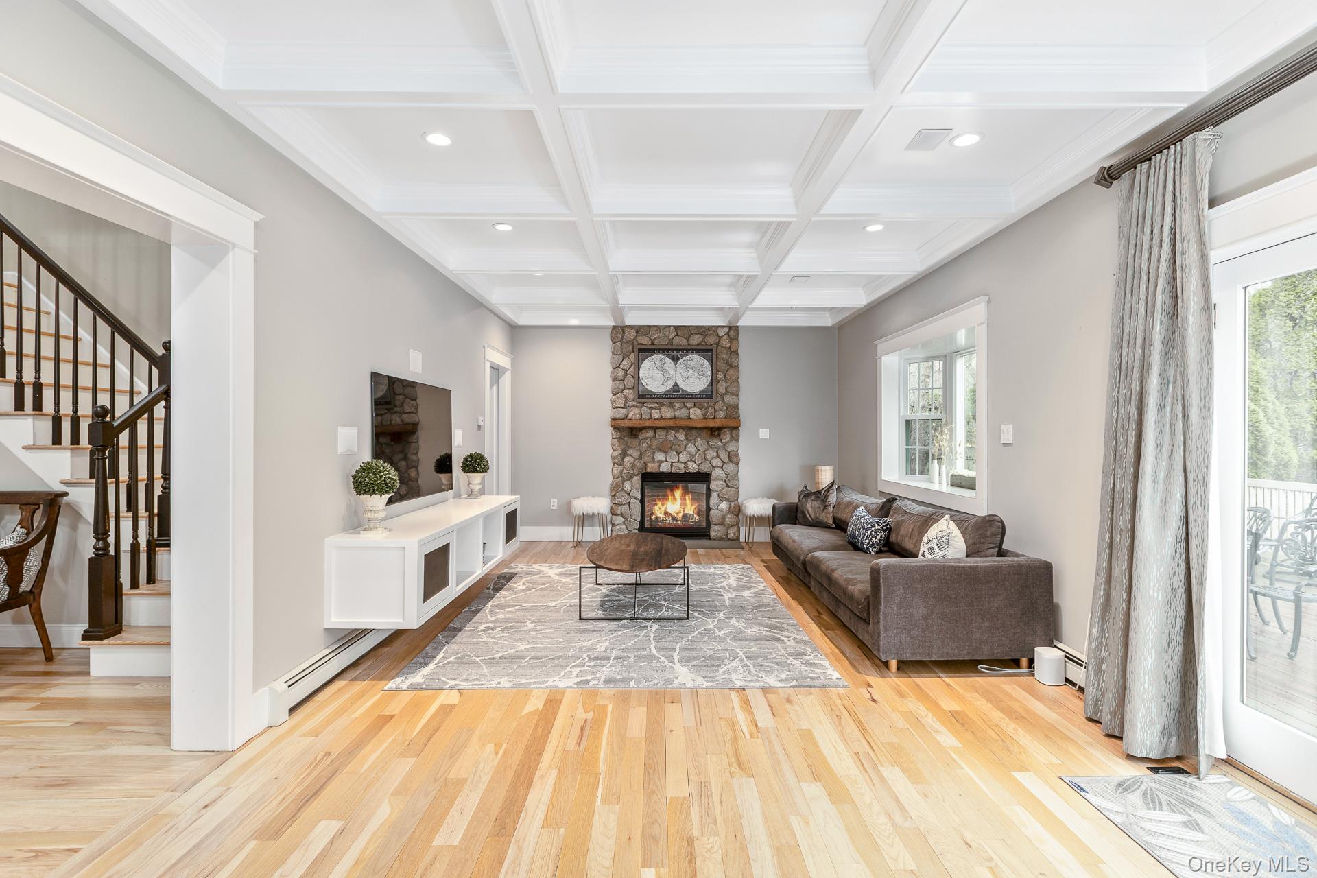26 Box Tree Road East Quogue, NY 11942 - Photo 12 of 49 a living room with furniture and a fireplace
