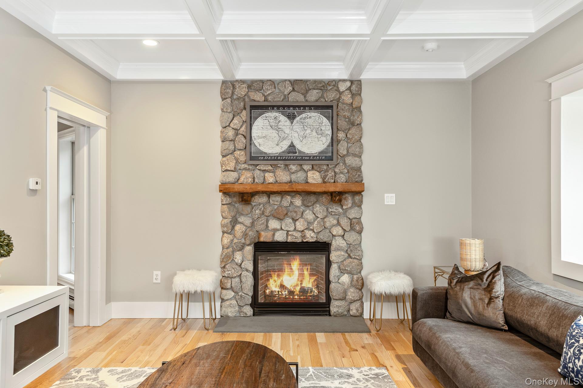 26 Box Tree Road East Quogue, NY 11942 - Photo 14 of 49 a living room with furniture and a fireplace