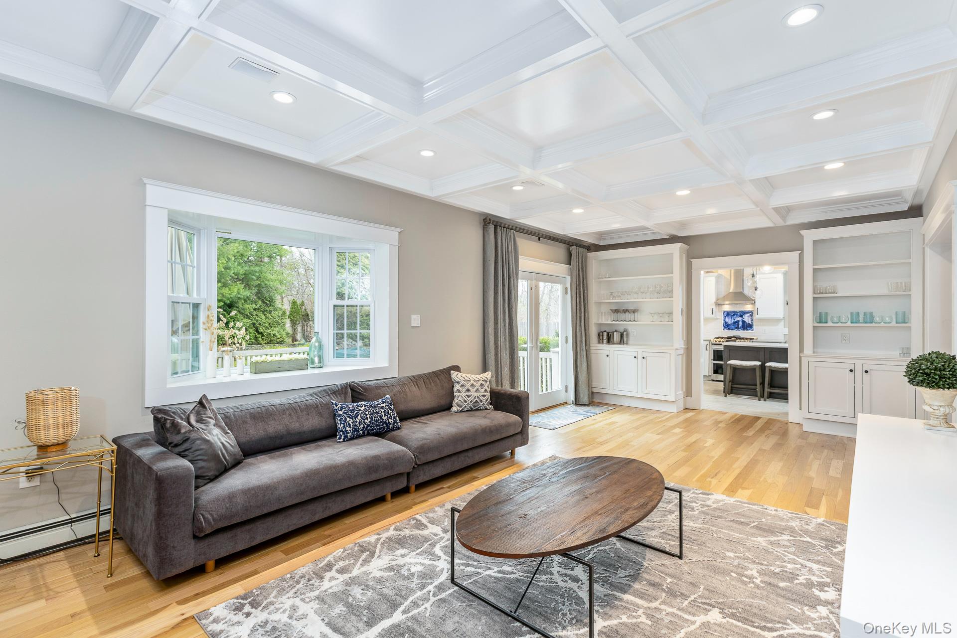 26 Box Tree Road East Quogue, NY 11942 - Photo 16 of 49 a living room with furniture and a large window