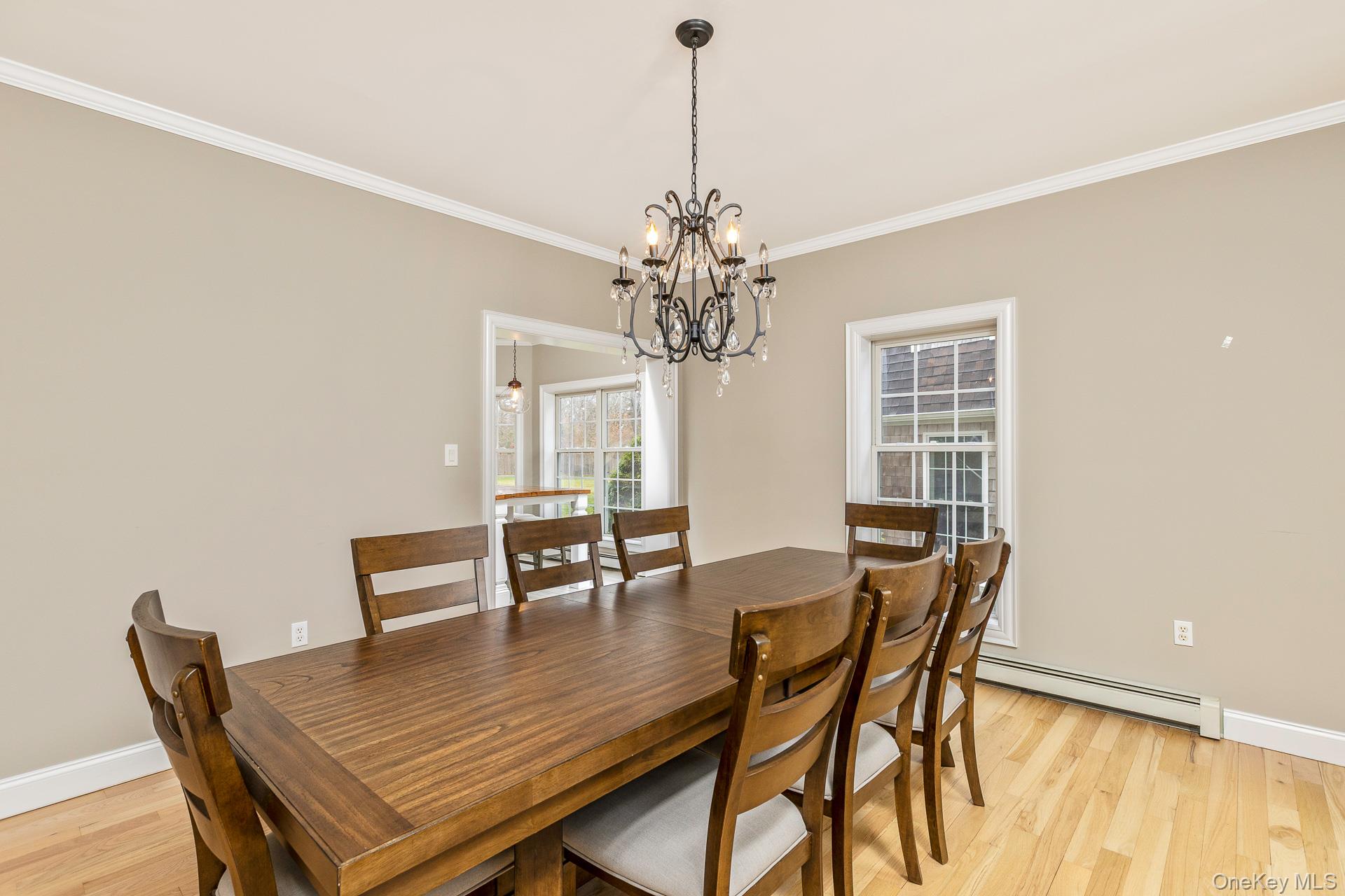 26 Box Tree Road East Quogue, NY 11942 - Photo 22 of 49 a dining room with furniture and window